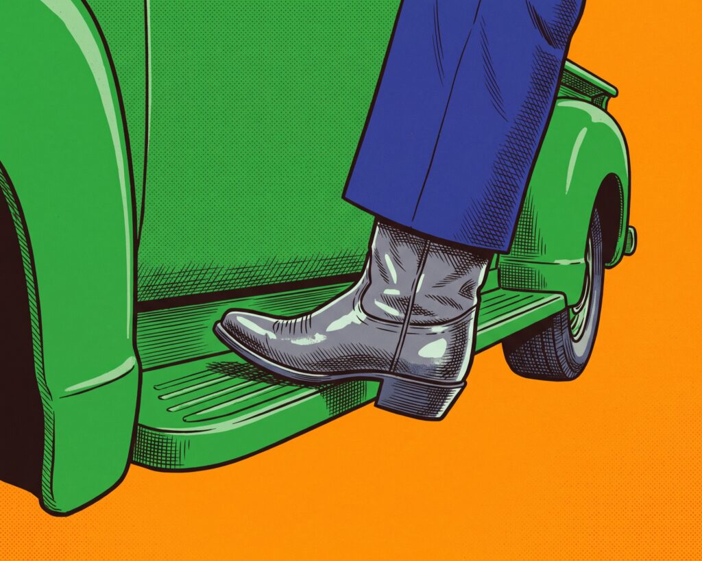 A lower leg in a dark suit trouser and a cowboy boot stepping onto a green truck's running board.